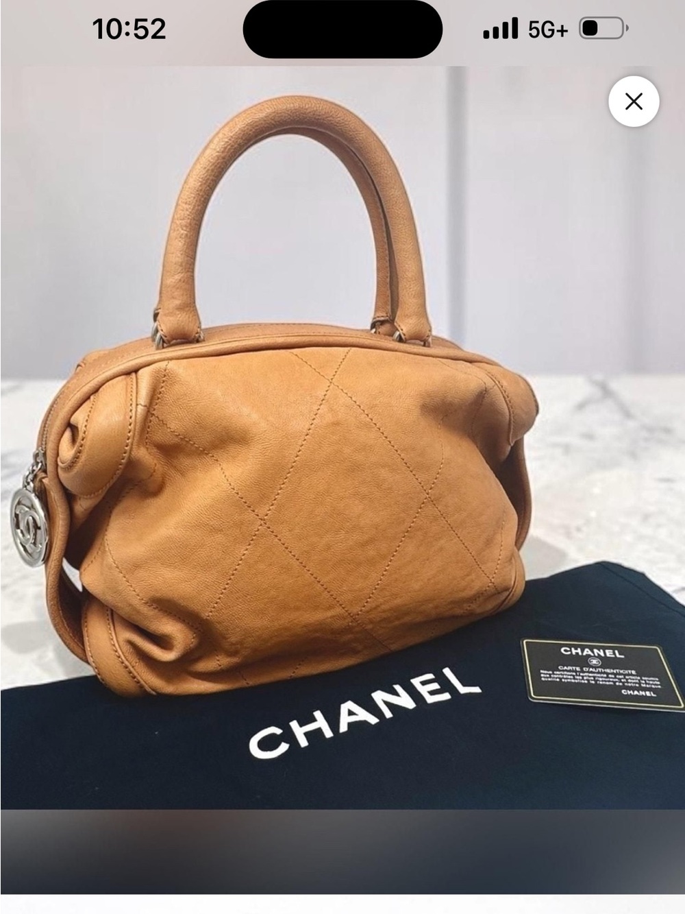 CHANEL Tan Leather bowler bag.